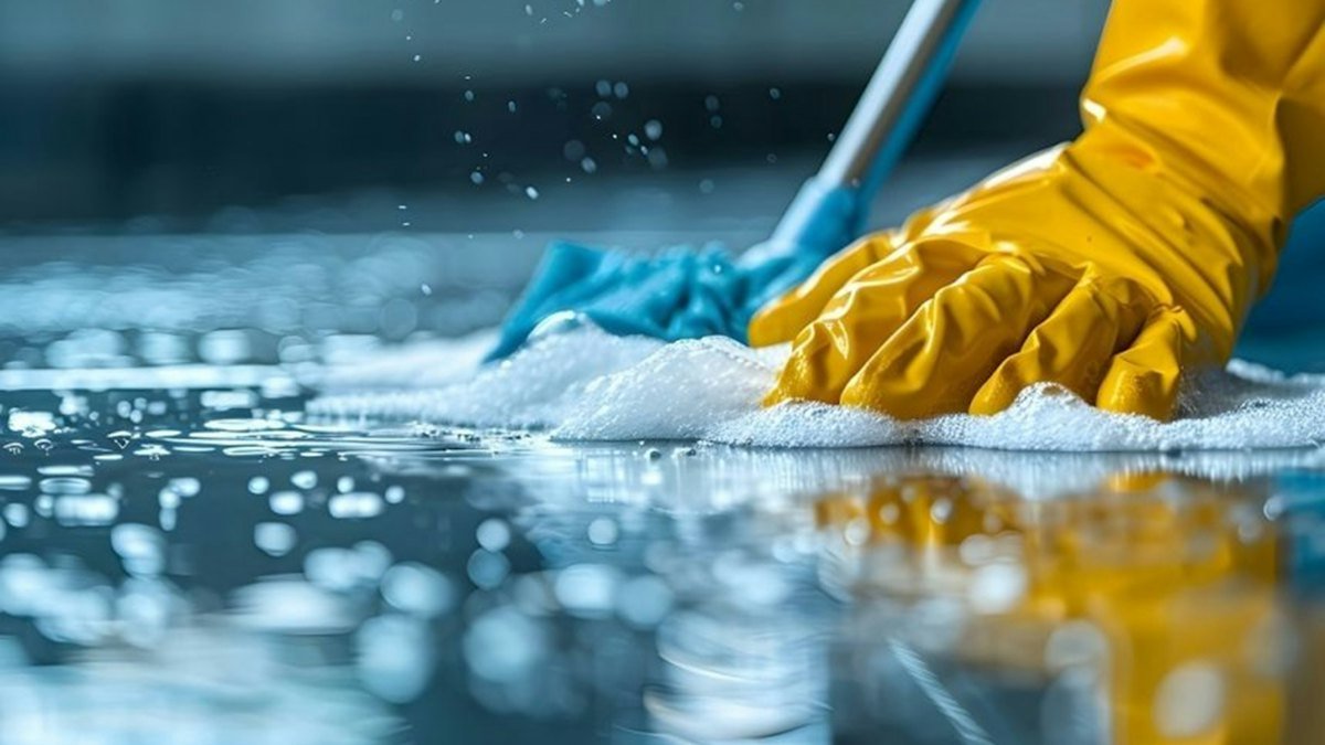 Cleaner mopping a floor – cleaning company website design in the UAE